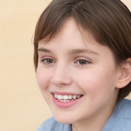 Joyful white child female with medium  brown hair and brown eyes