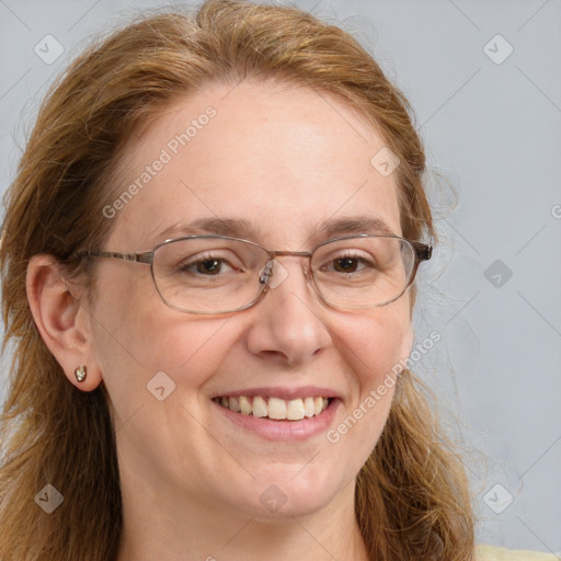 Joyful white adult female with long  brown hair and brown eyes