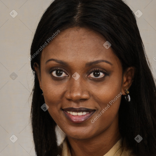 Joyful black young-adult female with long  brown hair and brown eyes