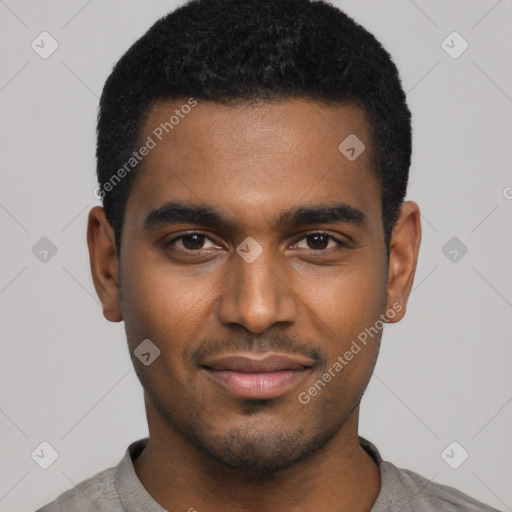 Joyful black young-adult male with short  black hair and brown eyes