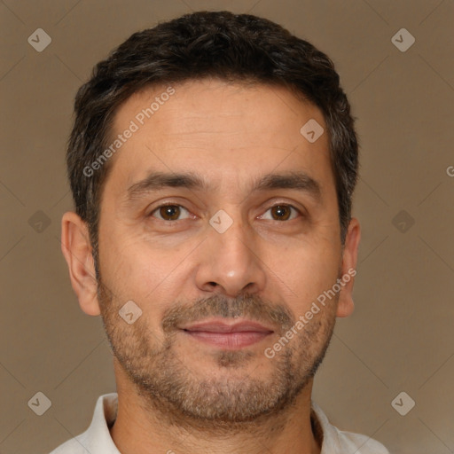 Joyful white adult male with short  brown hair and brown eyes