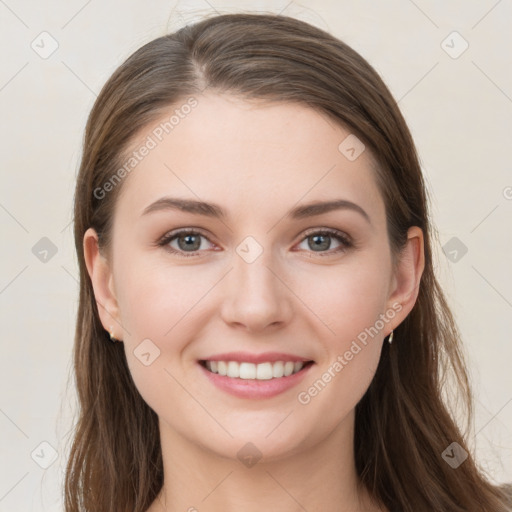 Joyful white young-adult female with long  brown hair and grey eyes