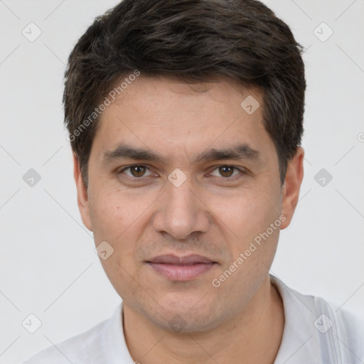 Joyful white adult male with short  brown hair and brown eyes