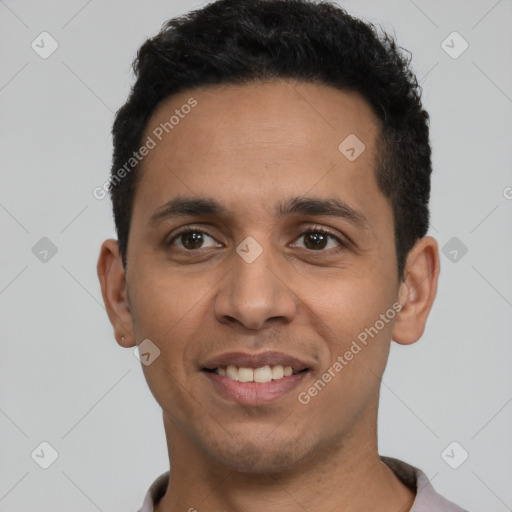 Joyful latino young-adult male with short  black hair and brown eyes