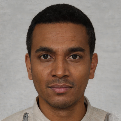 Neutral black young-adult male with short  black hair and brown eyes