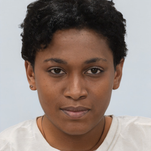 Joyful black young-adult female with short  brown hair and brown eyes