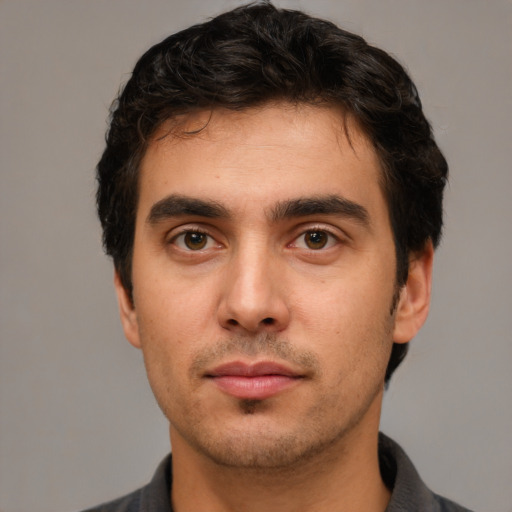 Neutral white young-adult male with short  black hair and brown eyes
