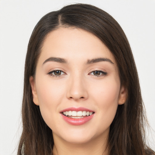 Joyful white young-adult female with long  brown hair and brown eyes