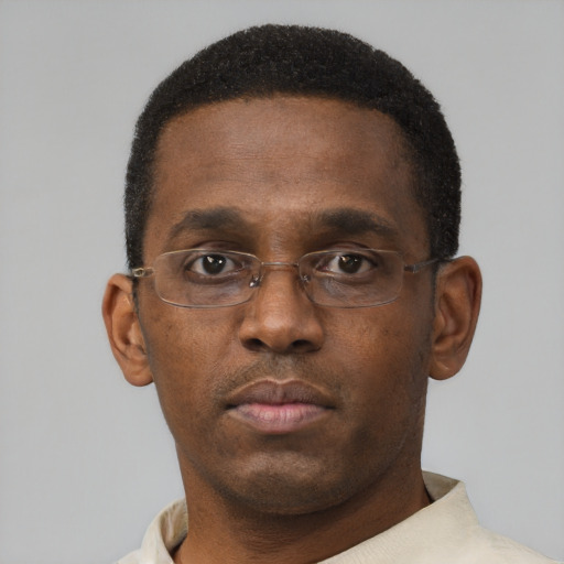 Neutral black young-adult male with short  black hair and brown eyes