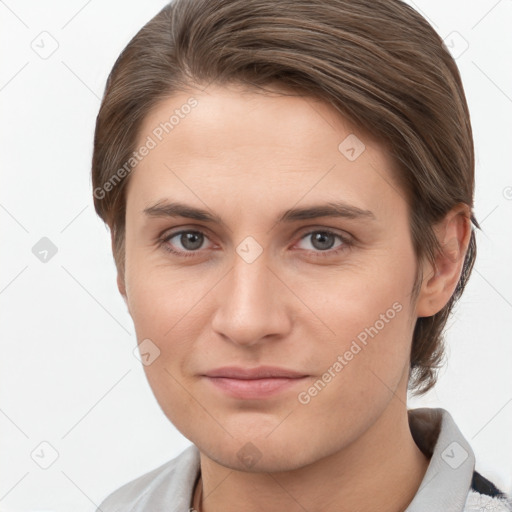 Joyful white young-adult female with short  brown hair and grey eyes