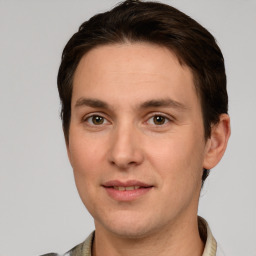 Joyful white adult male with short  brown hair and grey eyes