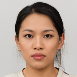 Neutral asian young-adult female with medium  black hair and brown eyes