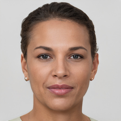 Joyful white young-adult female with short  brown hair and brown eyes