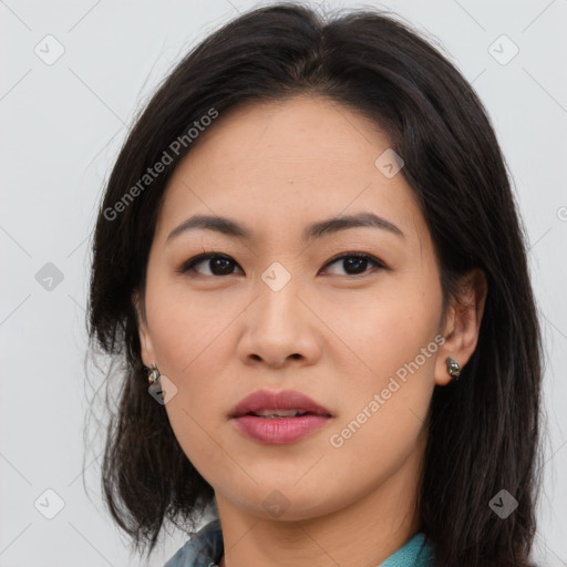 Joyful asian young-adult female with long  brown hair and brown eyes