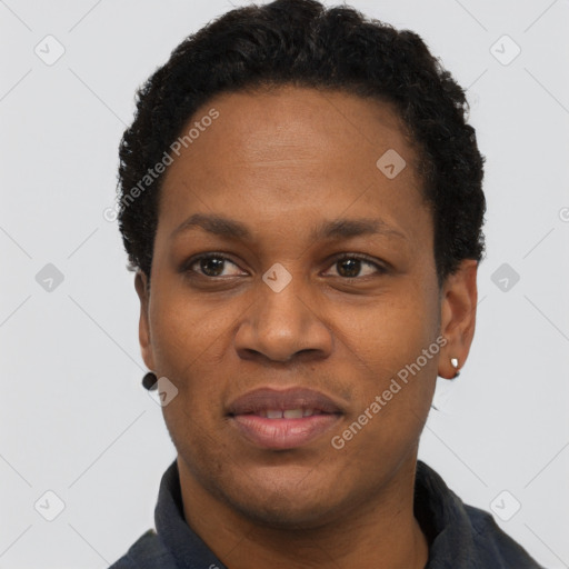 Joyful black adult female with short  black hair and brown eyes
