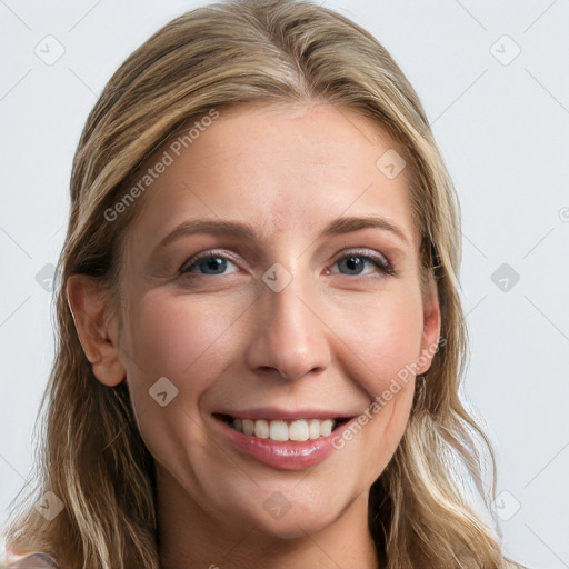 Joyful white young-adult female with long  brown hair and blue eyes