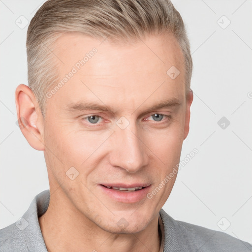 Joyful white adult male with short  brown hair and grey eyes