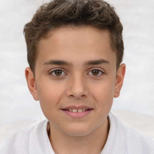 Joyful white child male with short  brown hair and brown eyes