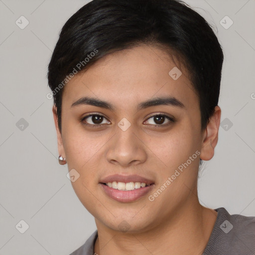 Joyful asian young-adult female with short  black hair and brown eyes