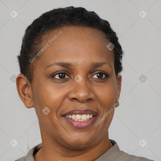 Joyful black adult female with short  brown hair and brown eyes