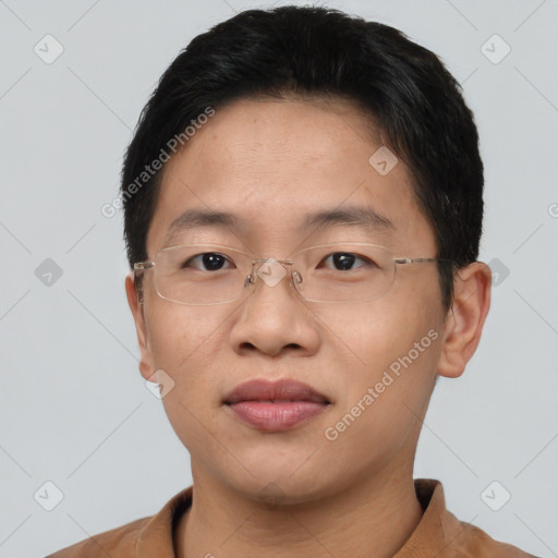 Joyful asian young-adult male with short  brown hair and brown eyes