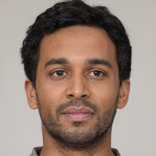 Neutral latino young-adult male with short  black hair and brown eyes