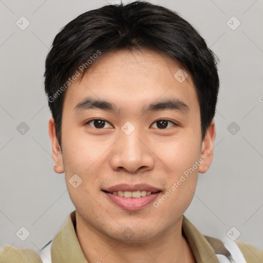 Joyful asian young-adult male with short  brown hair and brown eyes