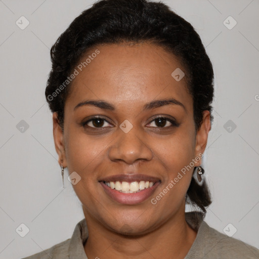 Joyful black young-adult female with short  black hair and brown eyes