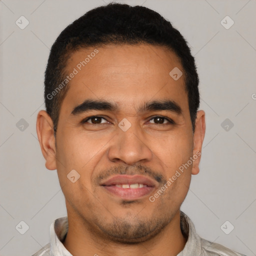 Joyful latino young-adult male with short  black hair and brown eyes