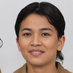 Joyful asian young-adult female with medium  brown hair and brown eyes