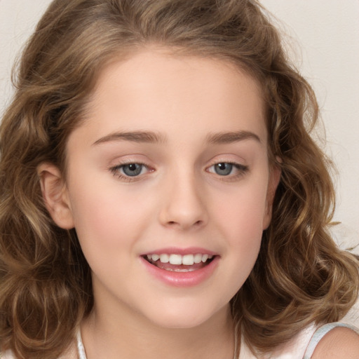 Joyful white child female with long  brown hair and brown eyes