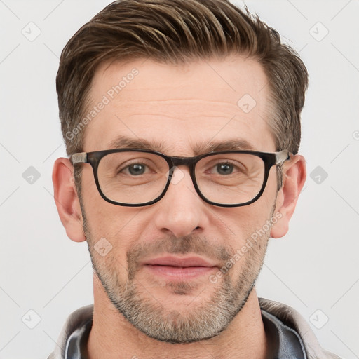 Joyful white adult male with short  brown hair and grey eyes