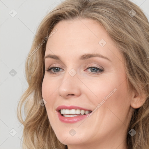 Joyful white young-adult female with long  brown hair and blue eyes