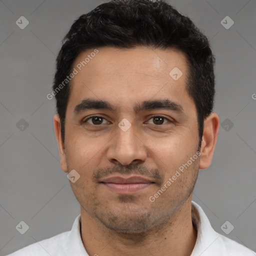 Joyful latino young-adult male with short  black hair and brown eyes