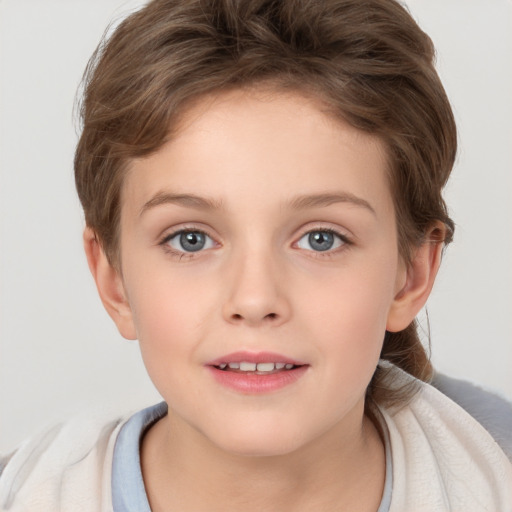 Joyful white child female with short  brown hair and brown eyes