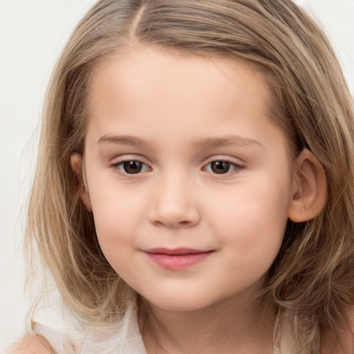 Joyful white child female with long  brown hair and brown eyes