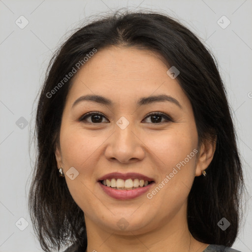 Joyful asian young-adult female with medium  brown hair and brown eyes