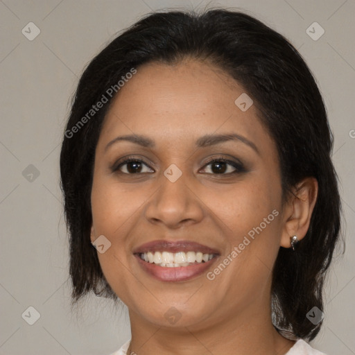 Joyful latino young-adult female with medium  brown hair and brown eyes