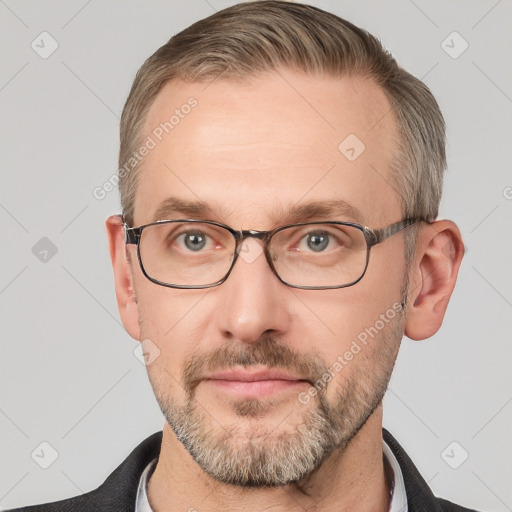 Neutral white adult male with short  brown hair and grey eyes