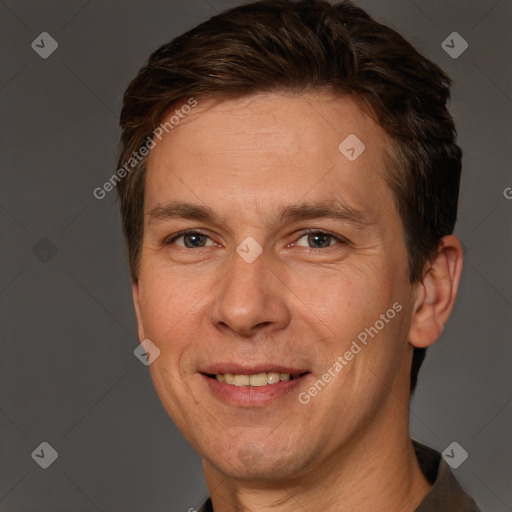 Joyful white adult male with short  brown hair and brown eyes