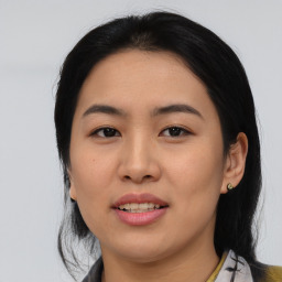 Joyful asian young-adult female with medium  black hair and brown eyes