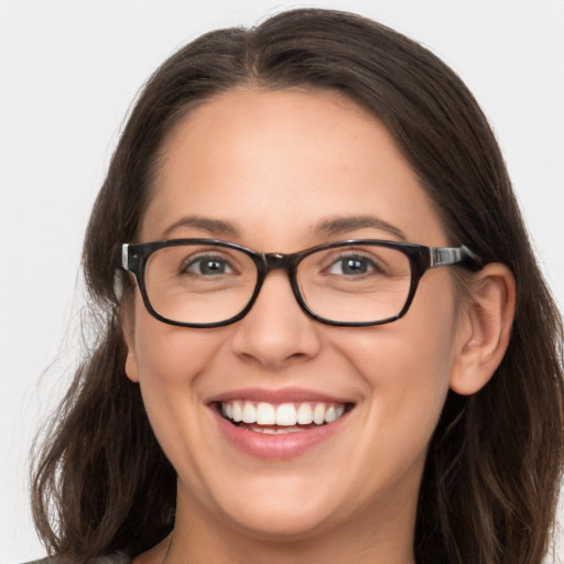 Joyful white young-adult female with long  brown hair and grey eyes