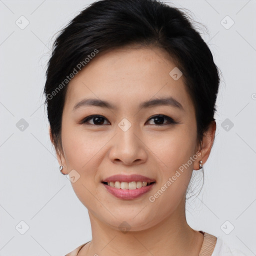 Joyful asian young-adult female with medium  brown hair and brown eyes