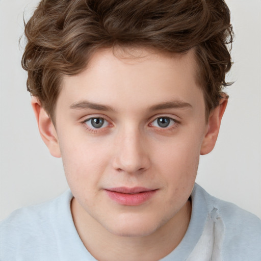 Joyful white child male with short  brown hair and brown eyes