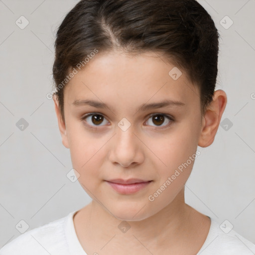 Joyful white child female with short  brown hair and brown eyes