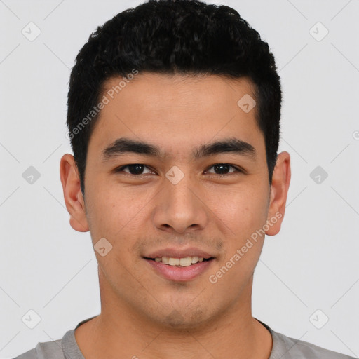 Joyful latino young-adult male with short  black hair and brown eyes