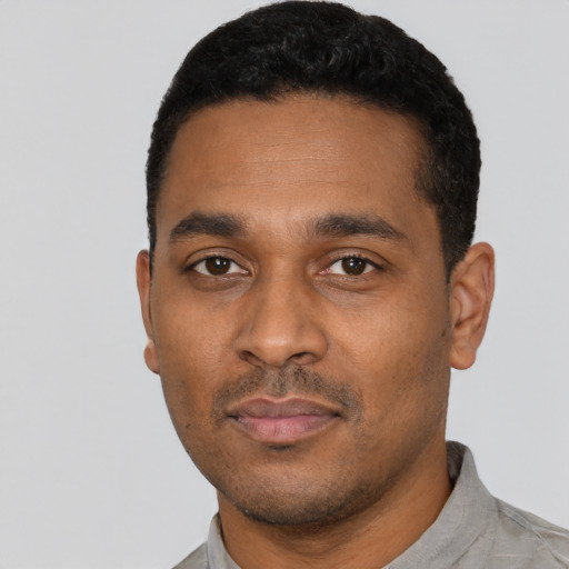 Neutral black young-adult male with short  black hair and brown eyes