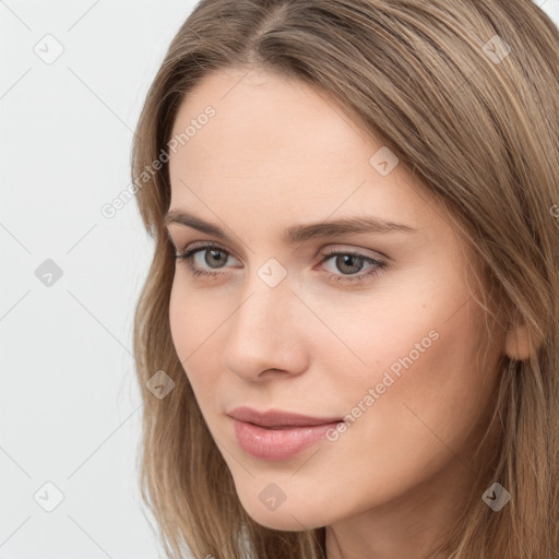 Neutral white young-adult female with long  brown hair and grey eyes