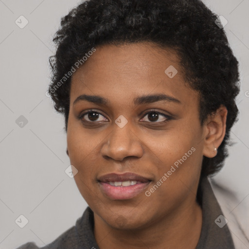 Joyful black young-adult female with short  black hair and brown eyes