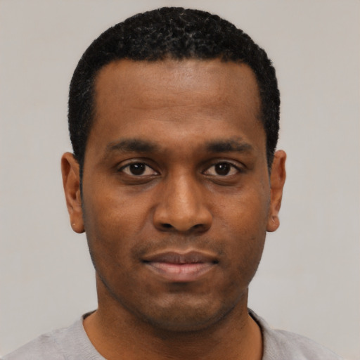 Neutral black young-adult male with short  black hair and brown eyes
